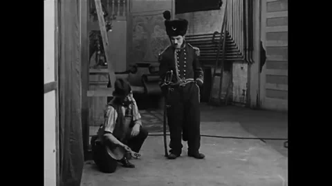 USA - 1915 - In this silent comedy, an actor on his way to set (Charlie Chaplin) Stock Footage 340581085
