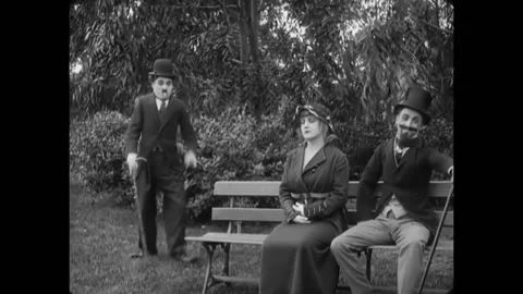 USA - 1915 - In this silent comedy, a poor man (Charlie Chaplin) fights for his 動画素材 277300388