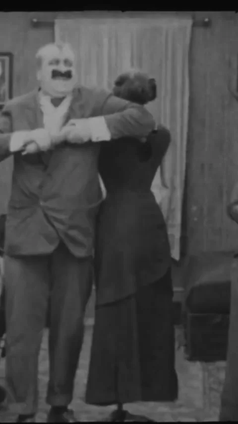 USA - 1915 - In this silent comedy, a tailor uses a hatchet to dismember a Stock Footage 342619655