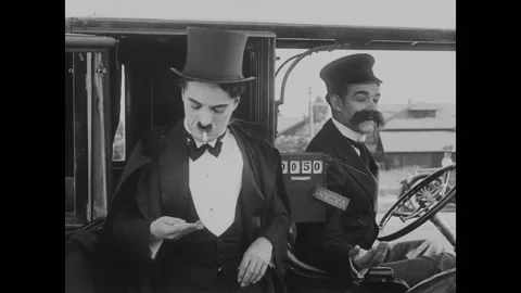 USA - 1916 - In this silent comedy, a drunk man (Charlie Chaplin) tries to pay Stock Footage 323262089