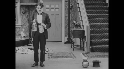 USA - 1916 - In this silent comedy, a drunk man (Charlie Chaplin) gets seltzer Stock Footage 323262670