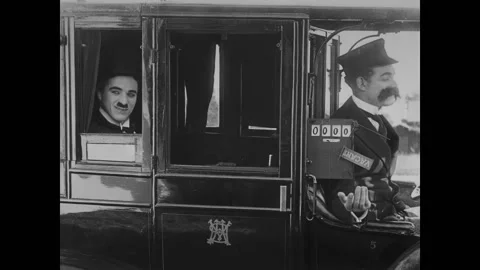 USA - 1916 - In this silent comedy, a drunk man (Charlie Chaplin) struggles to Stock Footage 323265352