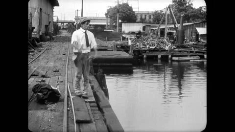 USA - 1916 - In this silent comedy, a lineman working on a telephone pole sees a Stock Footage 288083896