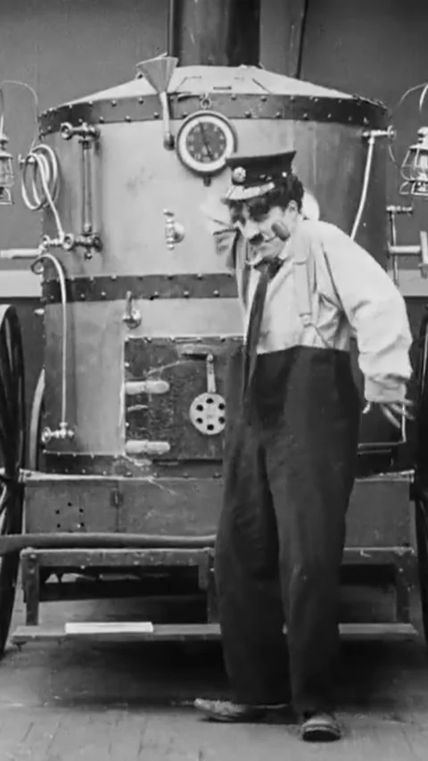 USA - 1916 - In this silent comedy, a man goes into a fire station to alert the Stock Footage 342833108