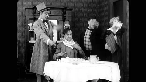 USA - 1916 - In this silent comedy, men prank a man into thinking he's slept a Stock Footage 304168382
