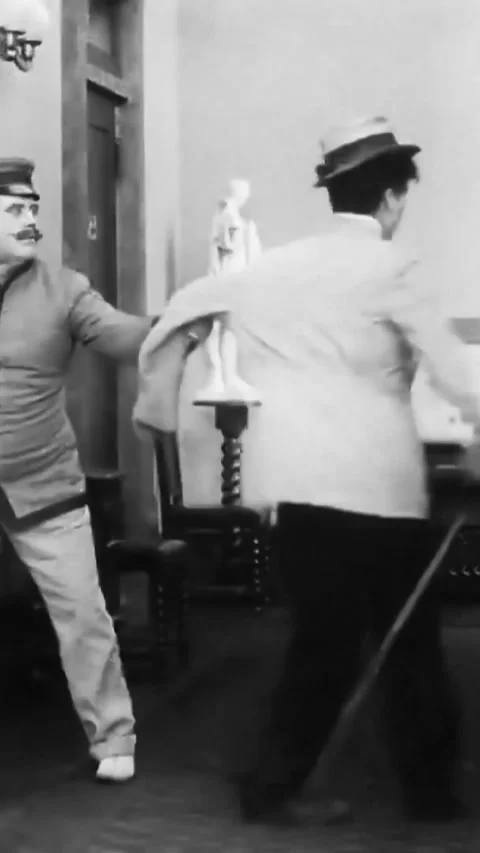 USA - 1917 - In this silent comedy, a dizzy hotel guest (Charlie Chaplin) has Stock Footage 339124171