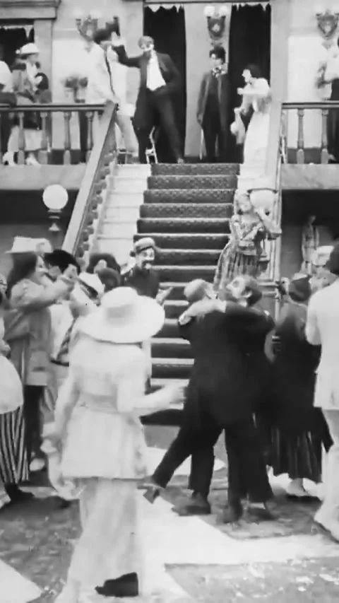 USA - 1917 - In this silent comedy, a man (Charlie Chaplin) is bewildered to Stock Footage 339124897