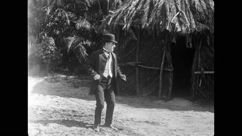 USA - 1920 - In this silent comedy, a man being chased by a tribe of cannibals Stock Footage 316410609