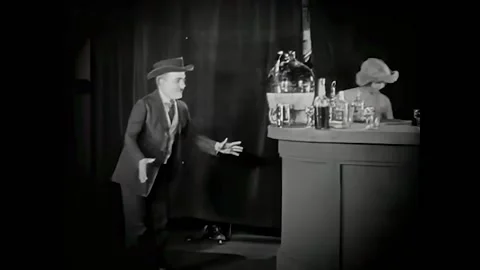 USA - 1920 - In this silent comedy, a pretty woman lures a man into a speakeasy Stock Footage 327737955