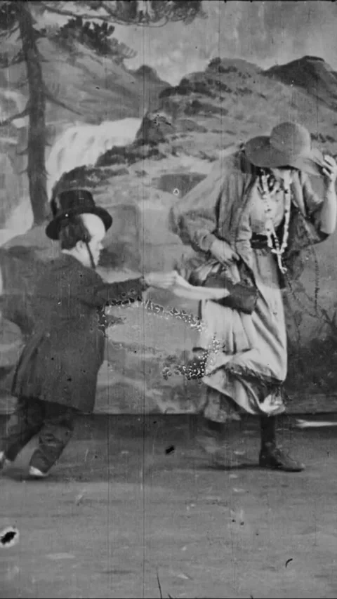 USA - 1920 - A Vaudeville act between a little person and double-jointed acrobat Stock Footage 339120186