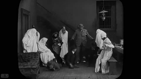 USA - 1921 - In this silent comedy, a man (Buster Keaton) dressed as a ghost Stock Footage 254148246