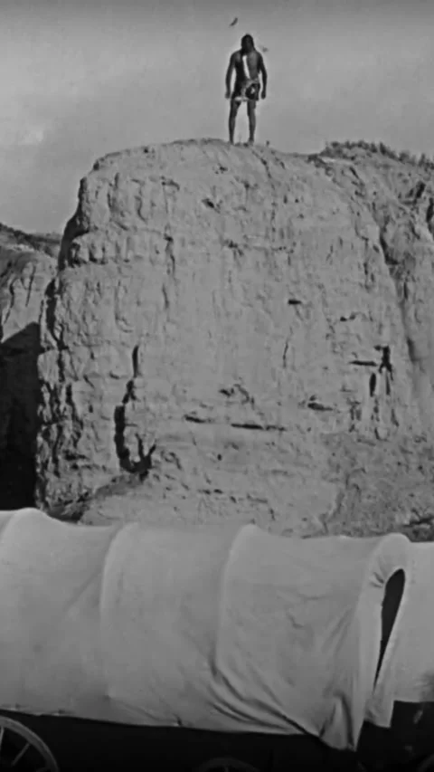 USA - 1923 - In this silent western, Native Americans light covered wagons on Stock Footage 342616624