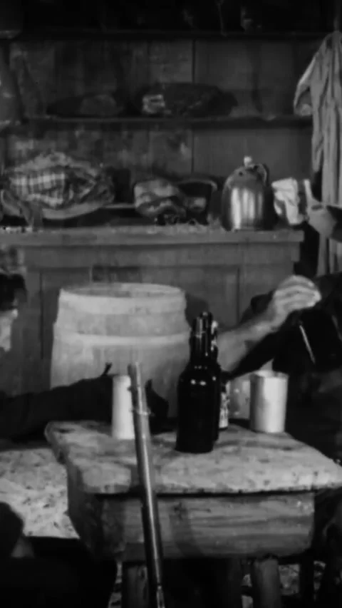 USA - 1923 - In this silent western, two drunk old friends in a saloon muse Stock Footage 342615897