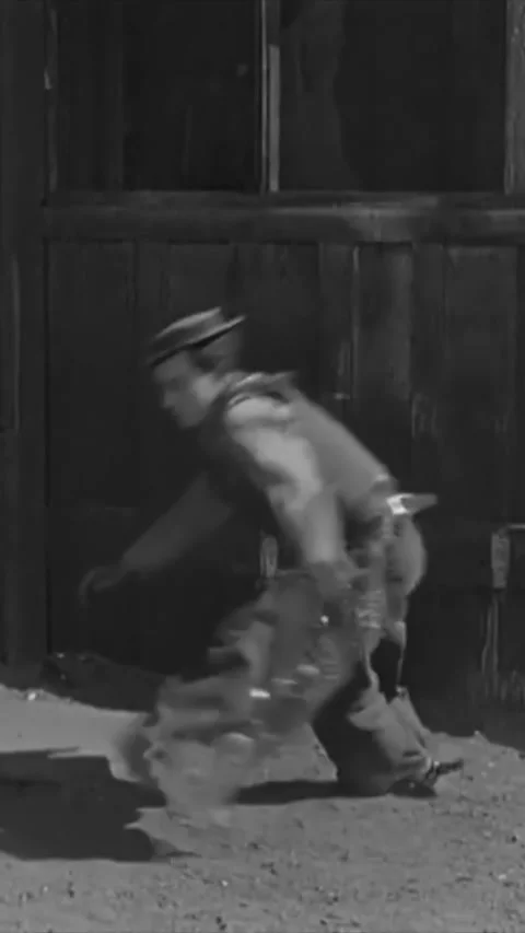 USA - 1925 - In this silent comedy, a cowboy (Buster Keaton) puts antlers on his Stock Footage 342995346