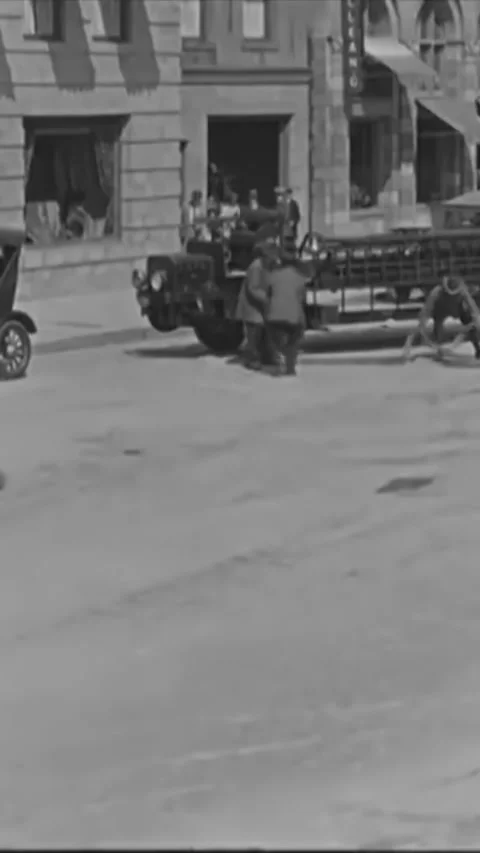 USA - 1925 - In this silent comedy, firemen shoot hoses at a herd of stampeding Stock Footage 342997104