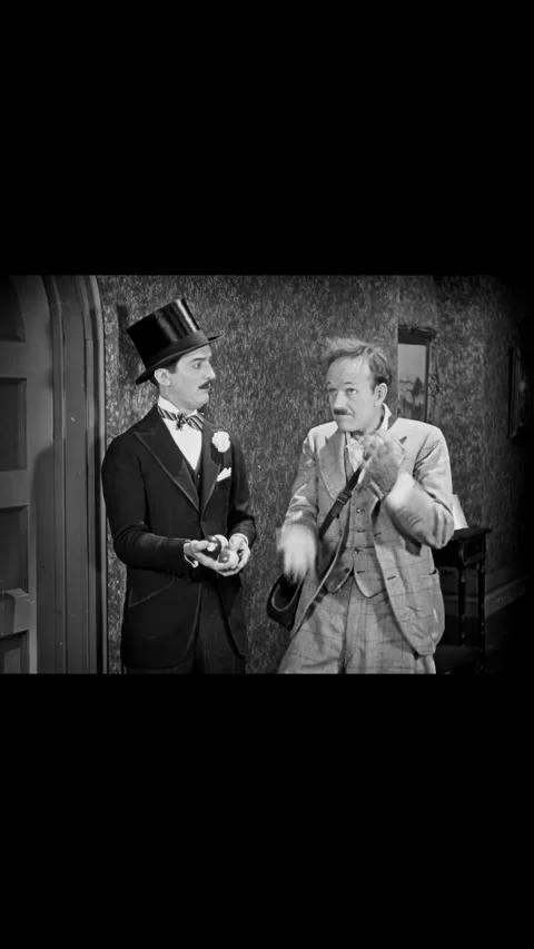 USA - 1925 - In this silent comedy, a man tasks another with juggling in order Stock-Footage 339805716