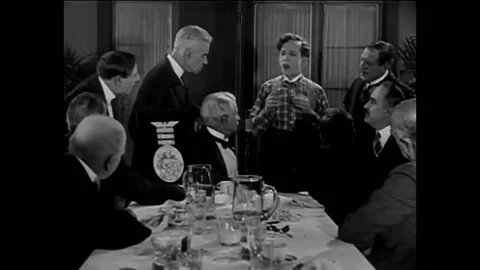 USA - 1926 - In this silent comedy, a man speaks to a group of gentlemen at a Stockbeeldmateriaal 325212939