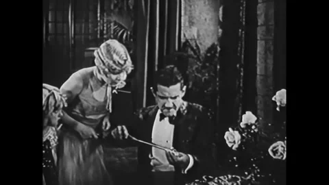 USA - 1927 - In this comedy, a man uses a long screwdriver on a lighter and Stock Footage 341991362