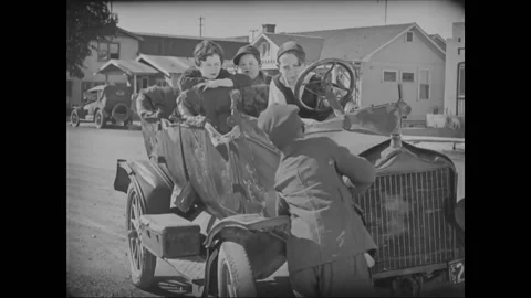 USA - 1927 - In this silent comedy, a boy moves a sleepy younger sibling from Stock Footage 323261863