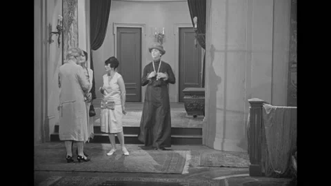 USA - 1927 - In this silent comedy, a man in drag falls down the stairs while Stock Footage 316612443