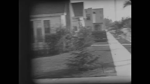 USA - 1927 - In this silent comedy, scared young boys swerve their car through Stock Footage 323259984