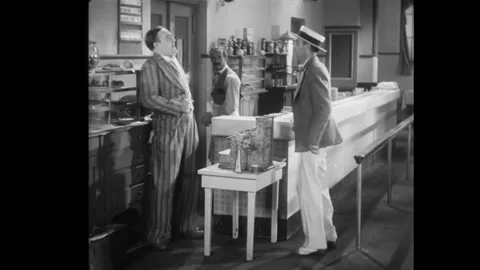 USA - 1929 - In this comedy, a man in a diner gives change to a man who gives Stock Footage 341989987