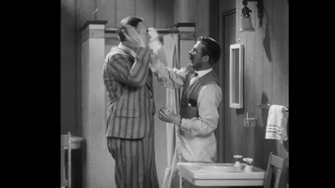 USA - 1929 - In this comedy, a man in a suit is cleaned up by a diner owner in a Stock Footage 341990027