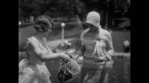 USA - 1929 - In this comedy, two sailors (Laurel and Hardy) think a woman has Stock Footage 304429536