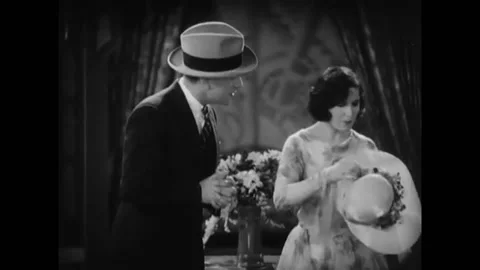 USA - 1929 - In this musical comedy, a man and woman joke in a room about cars Stock-Footage 328192000