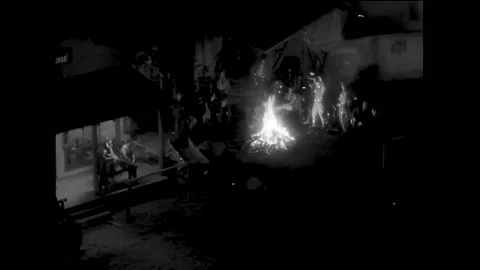 USA - 1929 - In this pre-code frontier sizzler, a group sings around a large Stock Footage 325210073