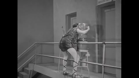 USA - 1929 - In this silent comedy, an actor on a wire gets flown around the Stock Footage 340573940