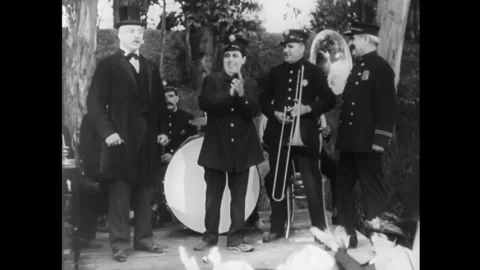 USA - 1929 - In this silent comedy, a bowing politician knocks a police band Stock Footage 316612401