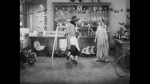 USA - 1929 - In this silent comedy, a boy frames a toy shop employee for hitting Stock Footage 316613823