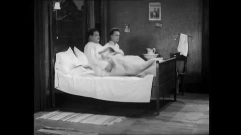USA - 1929 - In this silent comedy, Laurel and Hardy hide a goat under their bed Stock Footage 340662758