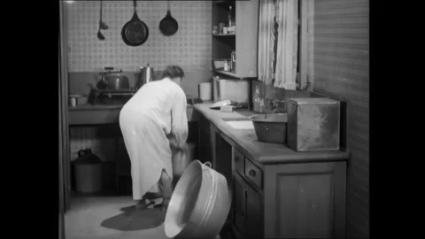 USA - 1929 - In this silent comedy, Laurel and Hardy step on a mouse trap while Stock Footage 340662769