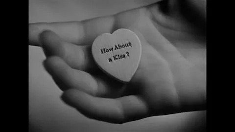 USA - 1930 - In this comedy, a little boy gives a woman a candy heart, asking Stock Footage 341989402