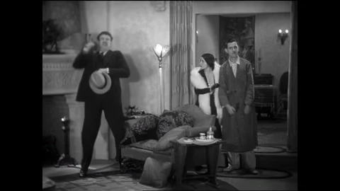 USA - 1930 - In this comedy, a man asks another man for a gun to end it all. The Stock Footage 341974414