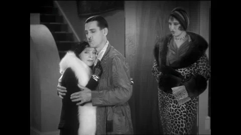 USA - 1930 - In this comedy, a man comforts a woman then another woman comes in Stock Footage 341974429