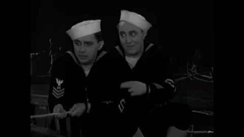 USA - 1930 - In this comedy, a sailor pulls out a handkerchief to soak up water, Stock Footage 327746944