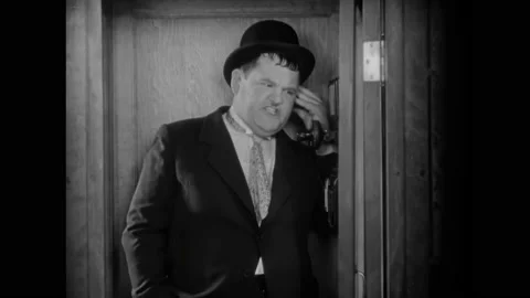 USA - 1930 - In this comedy, Stan Laurel tells Oliver Hardy he has the wrong Stock Footage 323081952