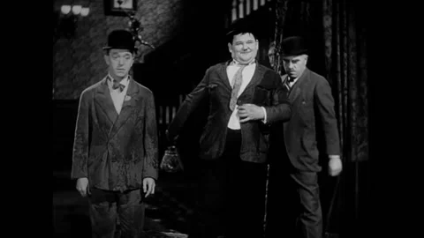 USA - 1930 - In this comedy, two men in bowler hats enter a parlor room. They Stock-Footage 325212399