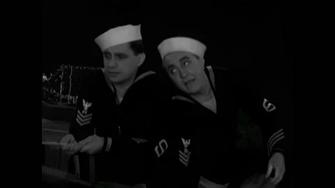 USA - 1930 - In this comedy, two sailors speak in a rowboat about a dead man. Stock Footage 327743807
