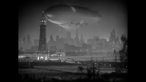 USA - 1930 - In this musical comedy, a blimp is shown over a city and Morse code Stock Footage 341990163