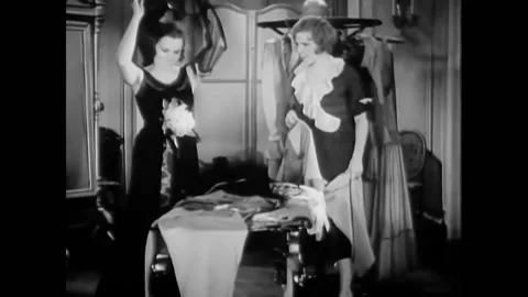 USA - 1930 - In this musical comedy, two women speak in a dressing room. A man Stock Footage 325206629