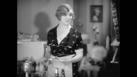 USA - 1930 - In this musical comedy, two women work in a kitchen yelling, they Stock Footage 325212480