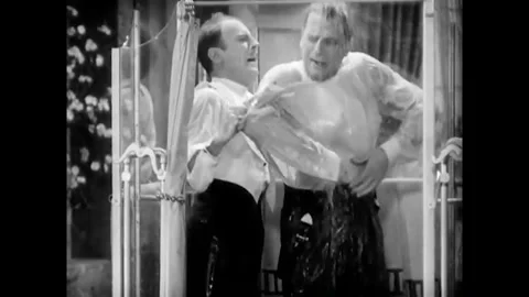 USA - 1930 - In this musical comedy, two men sing as they shower together in Stock Footage 341990066
