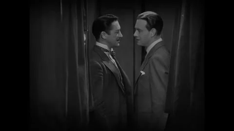 USA - 1930 - In this romantic drama, two men speak in a train car and then one Stock Footage 341973853