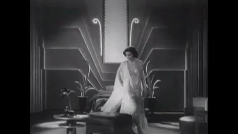 USA - 1930 - In this sci fi musical, a woman sits in an elegant futuristic room. Stock Footage 341982730