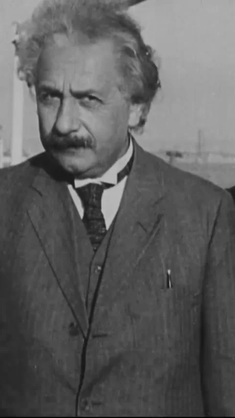 USA - 1931 - Albert Einstein and his wife disembark from a ship in California, Stock Footage 338390925