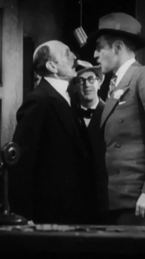 USA - 1931 - In this American pre-code comedy drama film, a man stands face to Stock Footage 342991273